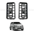 Two black car fog light covers with a silver car in the background
