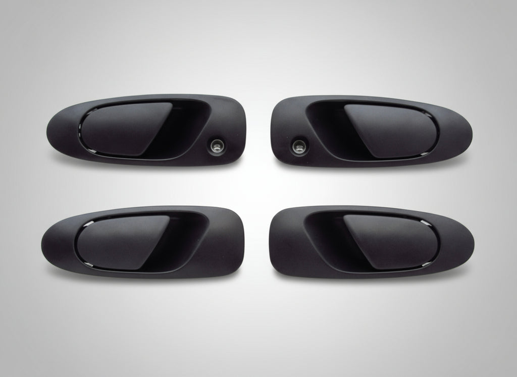 Four black car door handles on a white background