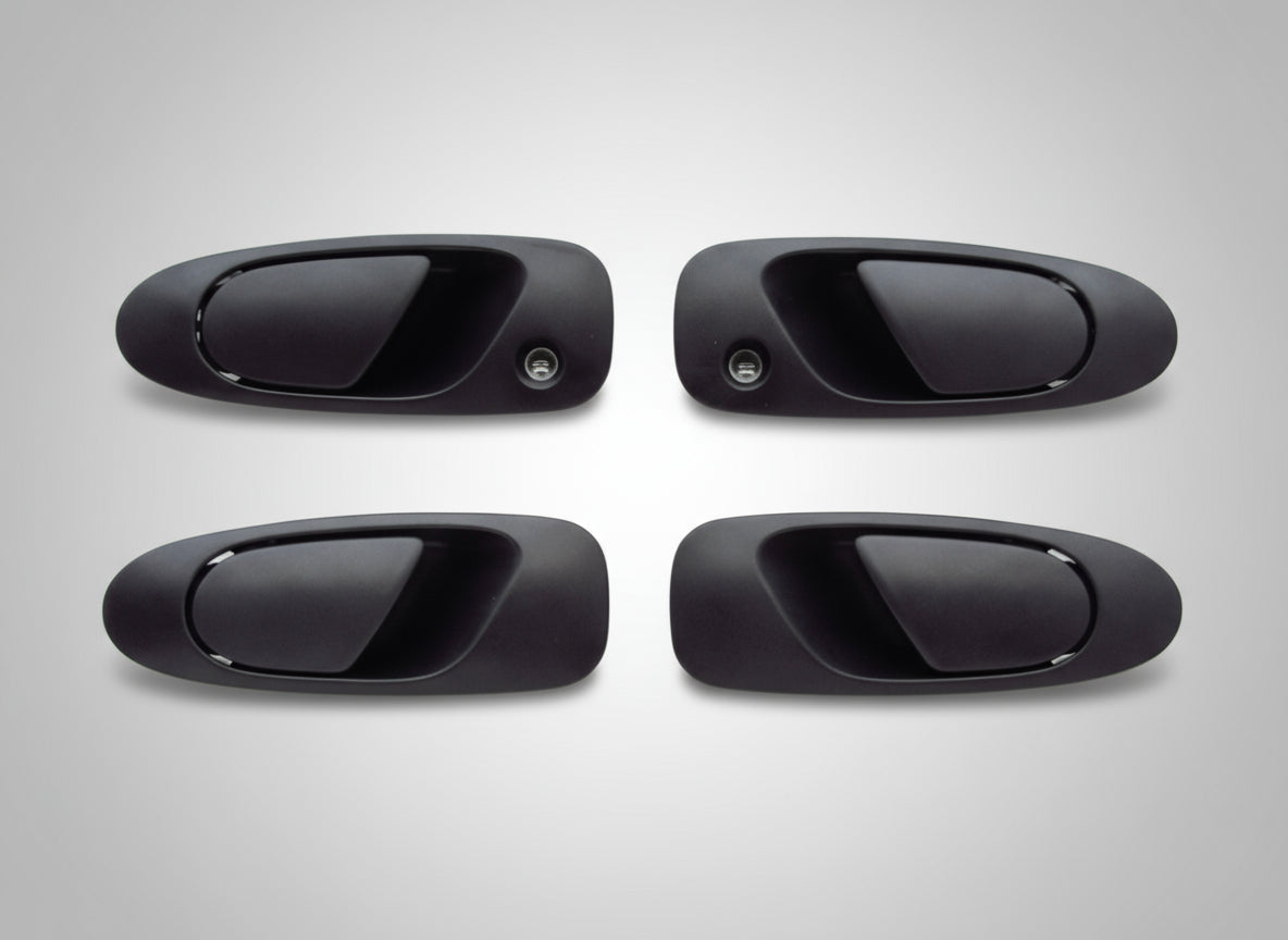 Four black car door handles on a white background