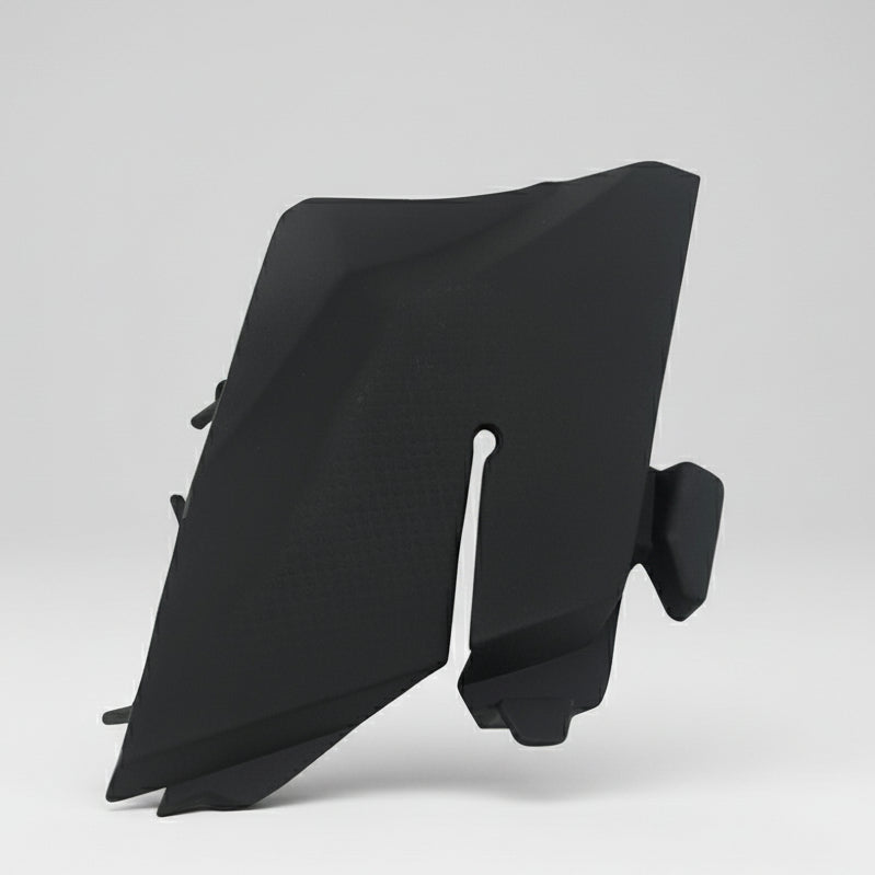 Black car side mirror cover on a white background